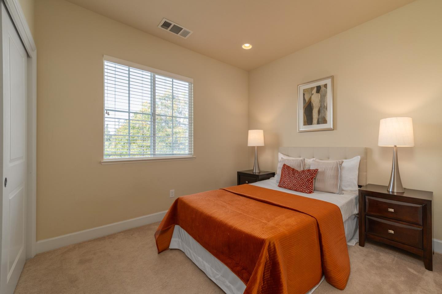 545 Holthouse Terrace Sunnyvale, CA 94087 - Photo 16 of 24 a bedroom with a bed and a window