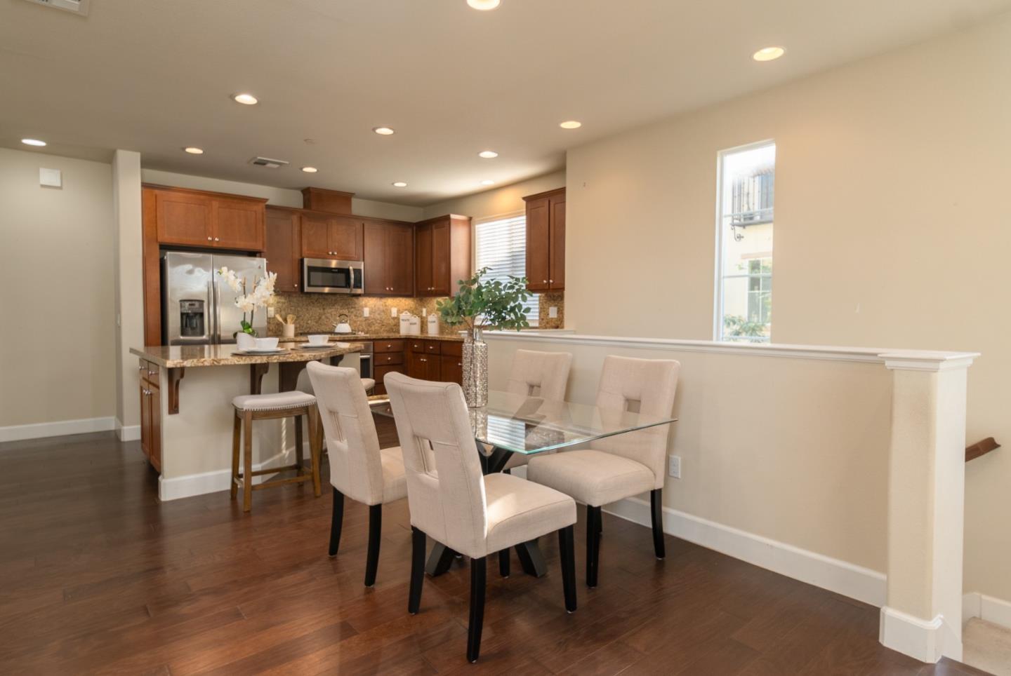 545 Holthouse Terrace Sunnyvale, CA 94087 - Photo 5 of 24 a view of a dining room with furniture and wooden floor
