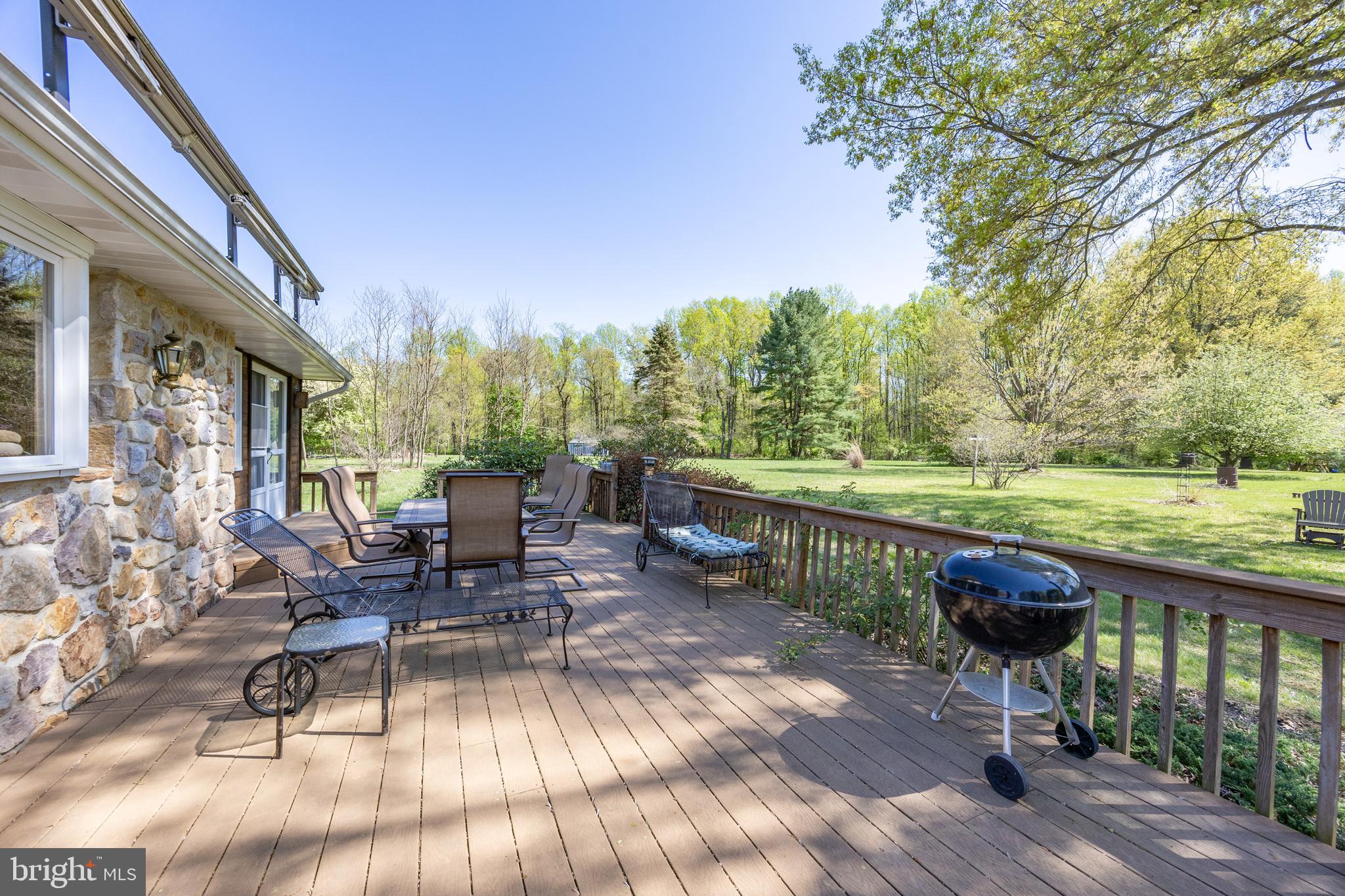 3076 Conestoga Road Glenmoore, PA 19343 - Photo 17 of 31 a view of a patio with a table chairs and a patio