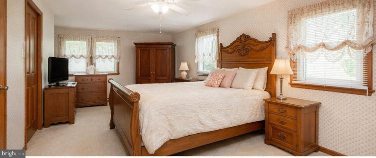 3076 Conestoga Road Glenmoore, PA 19343 - Photo 8 of 31 a bedroom with a bed and a television