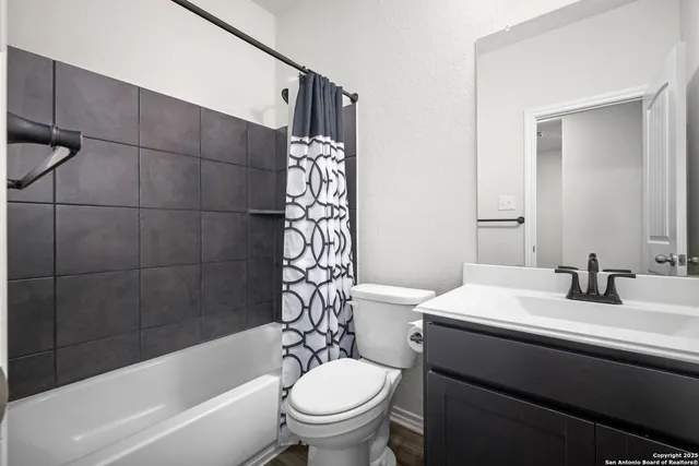 a bathroom with a sink a toilet and a bathtub