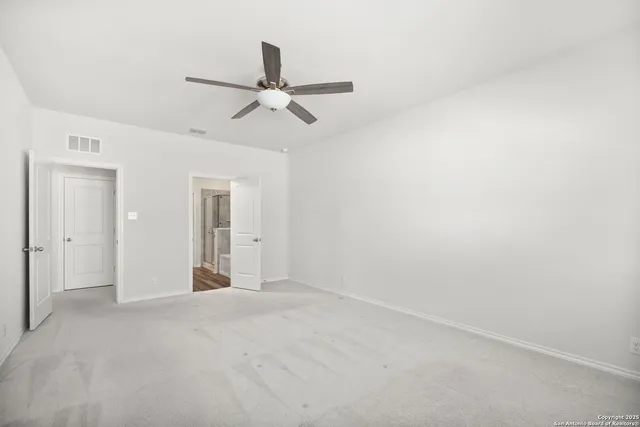 a view of a big room with carpet