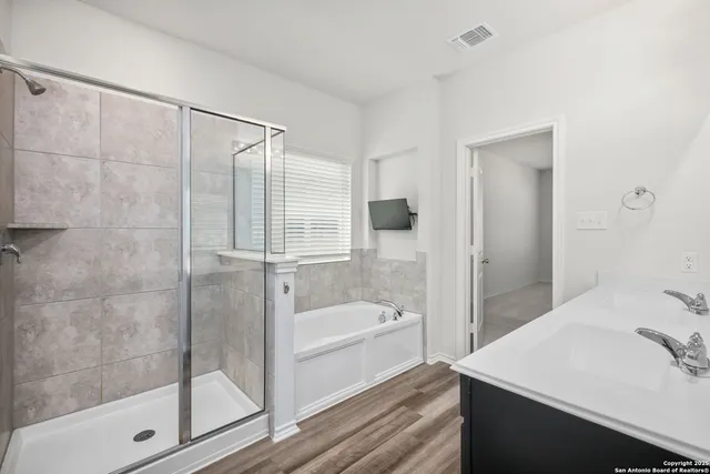 a bathroom with a sink and a shower