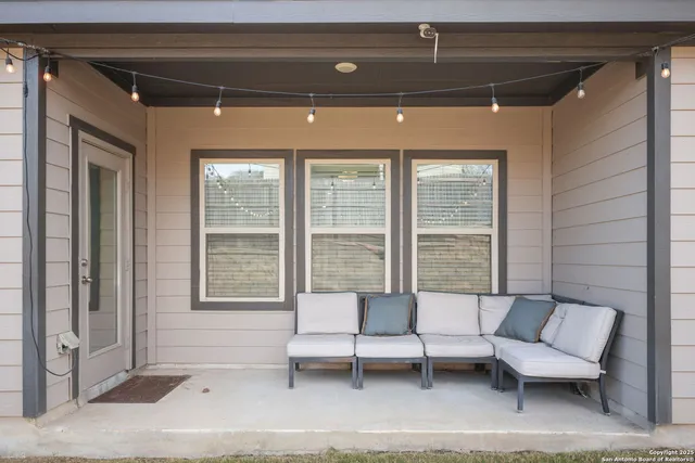a living room with furniture and a window