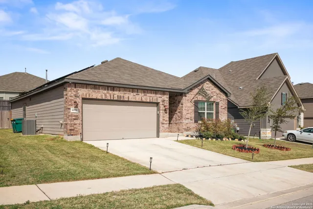 a view of the house with a yard