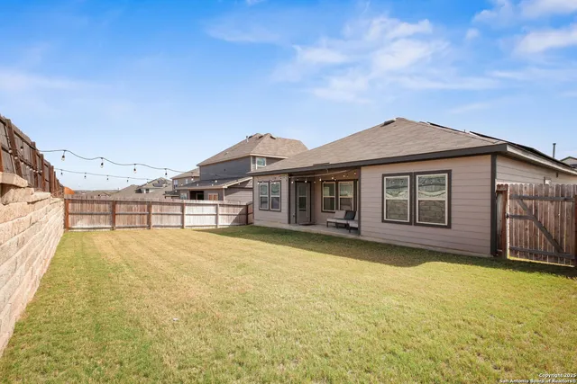 a house with swimming pool in front of it