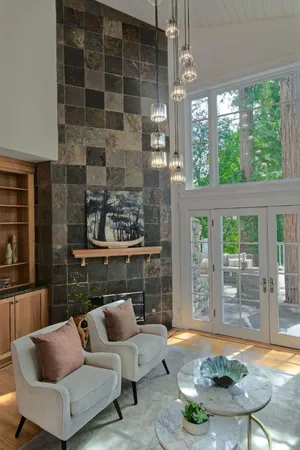 a living room with furniture and a fireplace