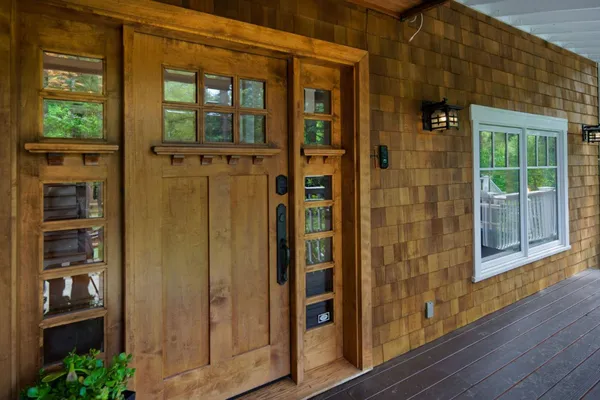 a view of a dining room with furniture and a potted plant