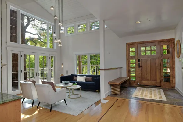 a kitchen with stainless steel appliances kitchen island granite countertop a sink and cabinets
