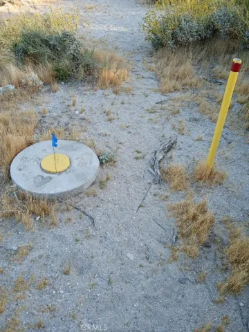 an aerial view of residential house and sandy dunes