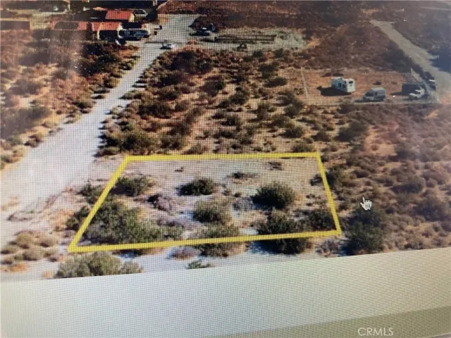 a view of mountain with sunset in background