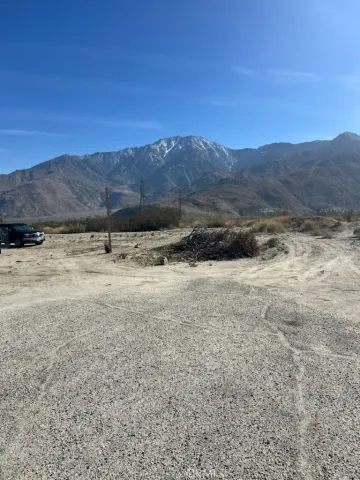 a view of a yard with a mountain