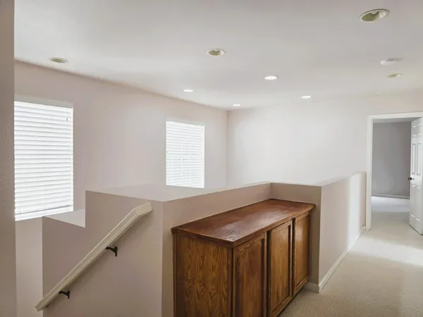 a kitchen with a wooden floor and window