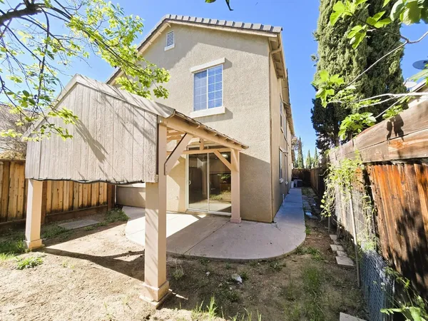 a view of a house with a small yard