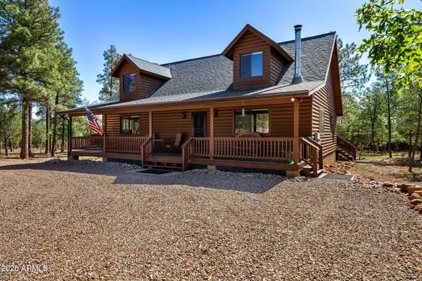 a view of house with a outdoor space and porch