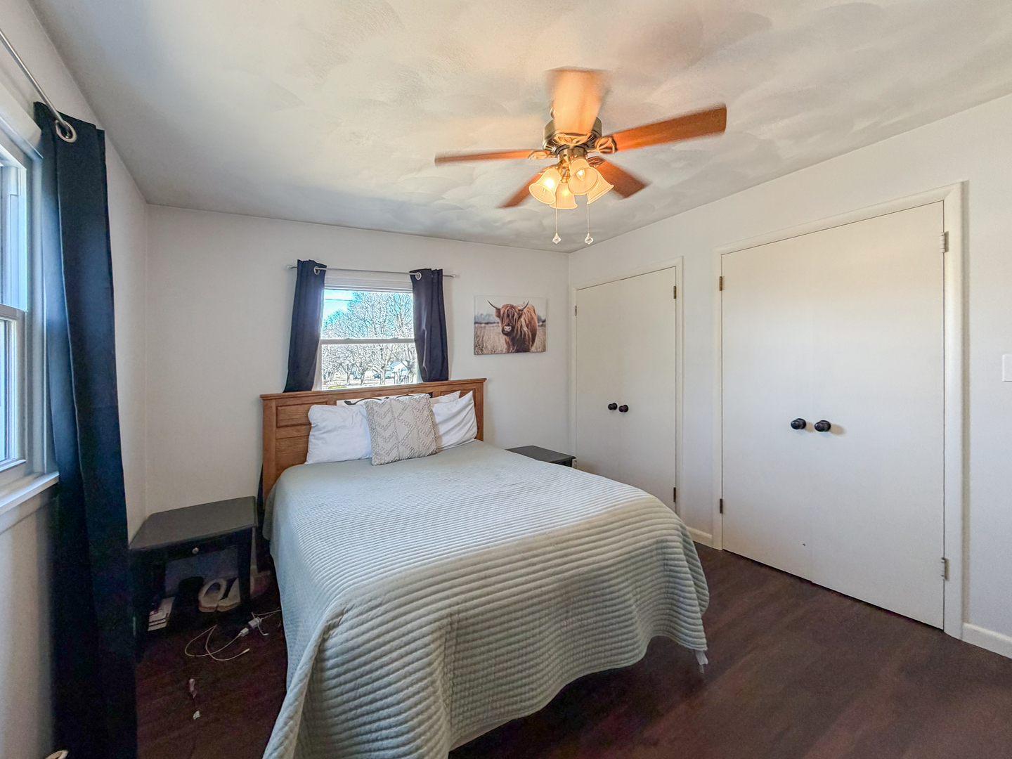 1506 South Walnut Avenue Freeport, IL 61032 - Photo 11 of 24 a bedroom with a bed and a chandelier