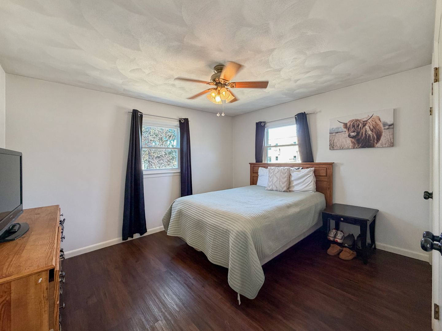 1506 South Walnut Avenue Freeport, IL 61032 - Photo 12 of 24 a bedroom with a bed and a chandelier