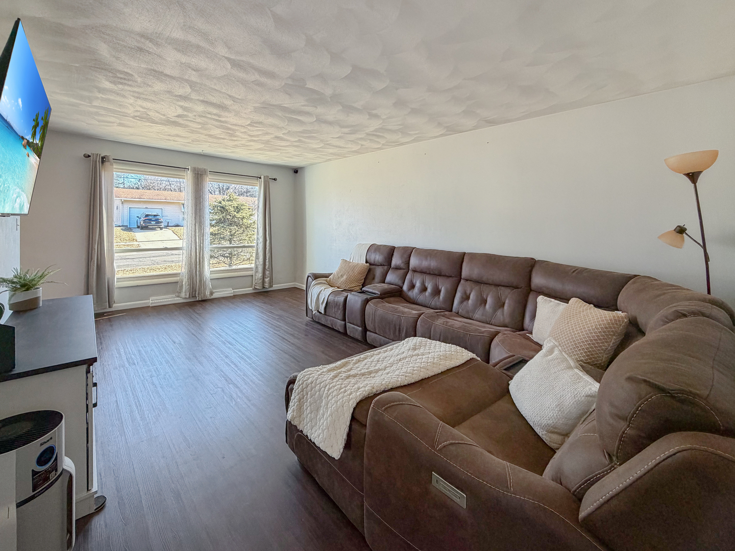 1506 South Walnut Avenue Freeport, IL 61032 - Photo 2 of 24 a living room with a couch and a wooden floor