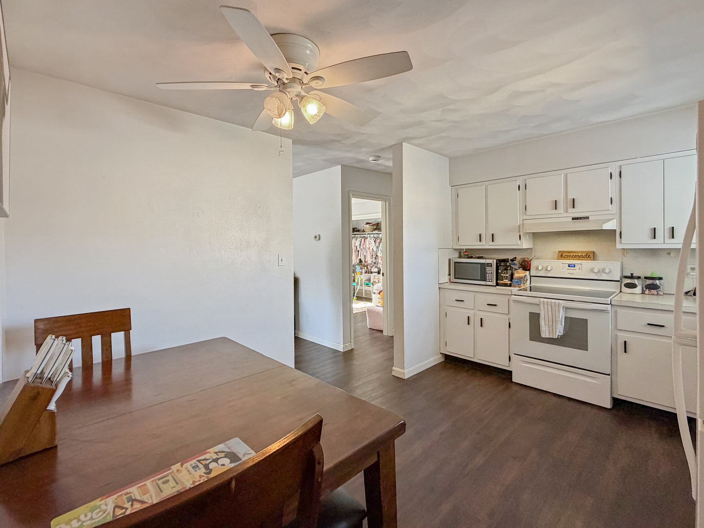 1506 South Walnut Avenue Freeport, IL 61032 - Photo 5 of 24 a kitchen with white cabinets and white appliances