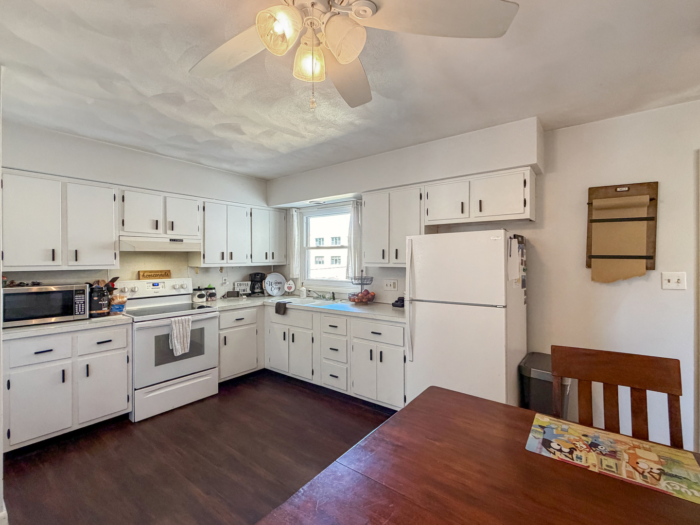 1506 South Walnut Avenue Freeport, IL 61032 - Photo 6 of 24 a kitchen with granite countertop white cabinets and white appliances