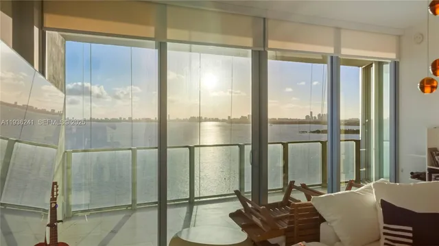 a living room with a glass door shower and furniture