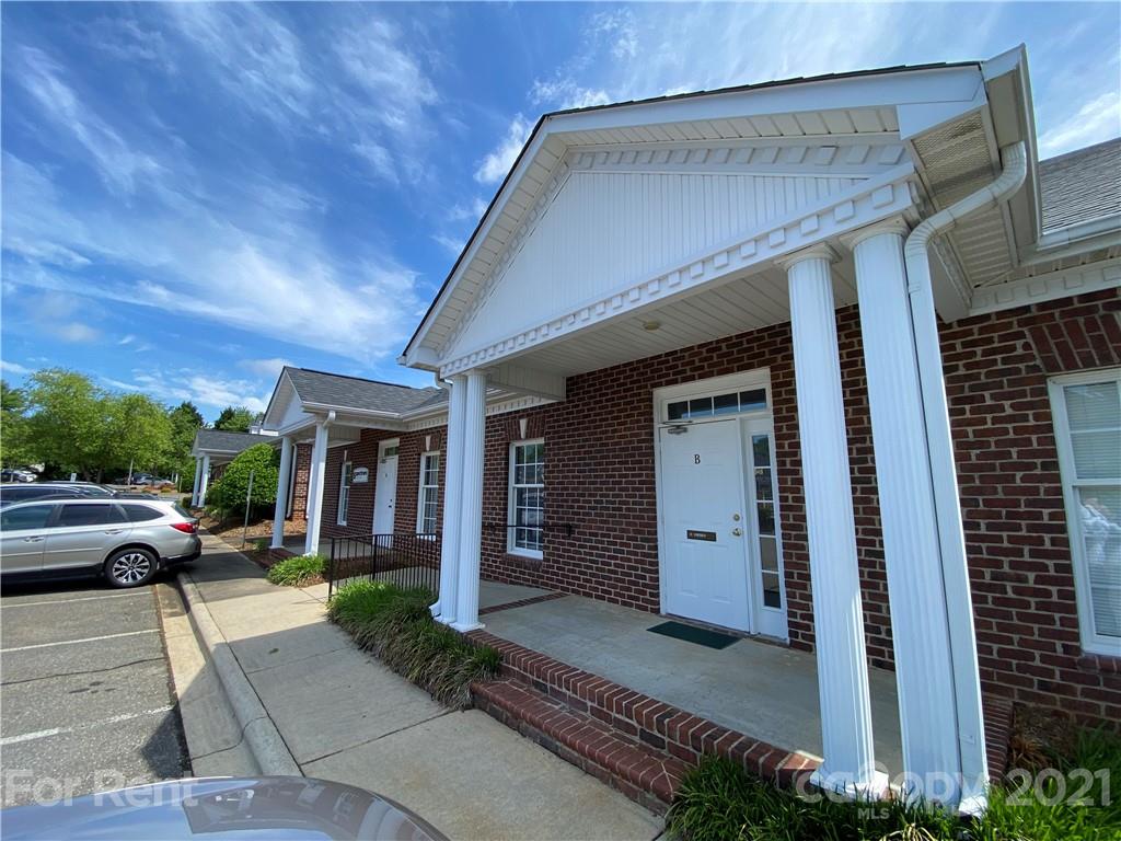 1552 Union Road, Unit B Gastonia, NC 28054 - Photo 1 of 12 a view of a building with car parked