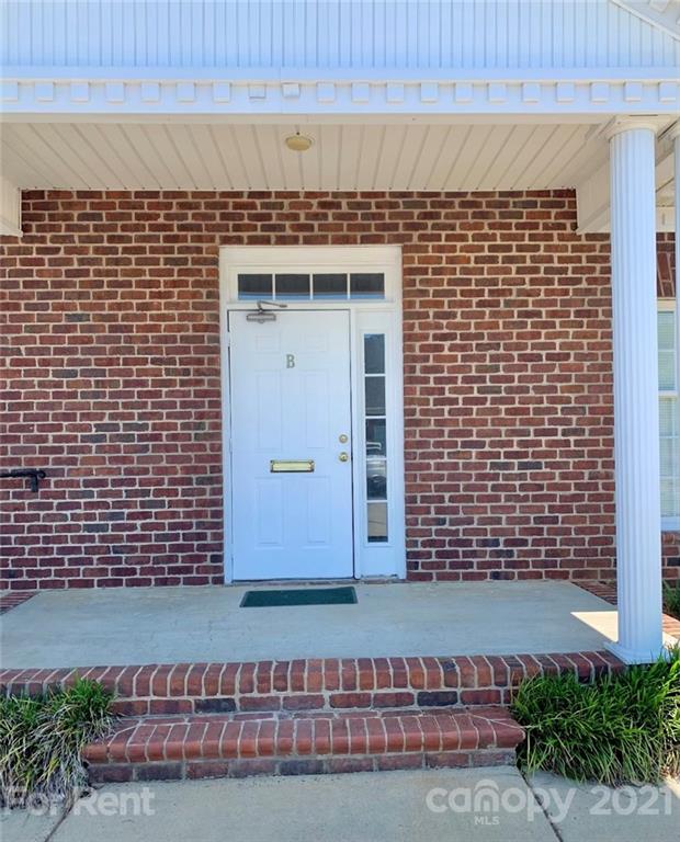 1552 Union Road, Unit B Gastonia, NC 28054 - Photo 2 of 12 a front view of a building with a garden
