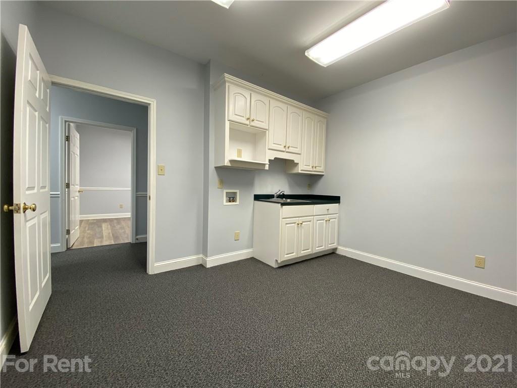 1552 Union Road, Unit B Gastonia, NC 28054 - Photo 11 of 12 a kitchen with stainless steel appliances a sink stove and cabinets
