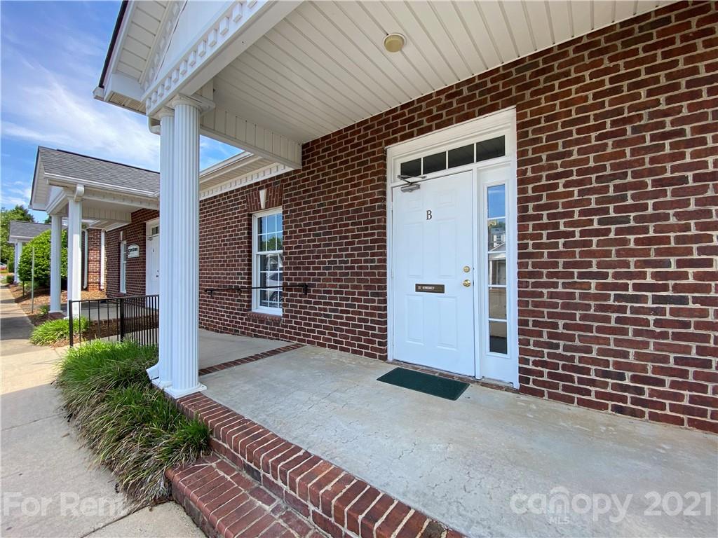 1552 Union Road, Unit B Gastonia, NC 28054 - Photo 3 of 12 a front view of a house with a garage