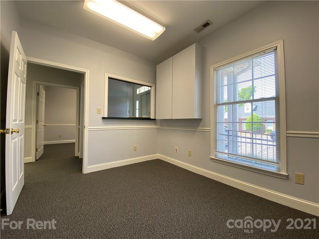 1552 Union Road, Unit B Gastonia, NC 28054 - Photo 6 of 12 an empty room with windows
