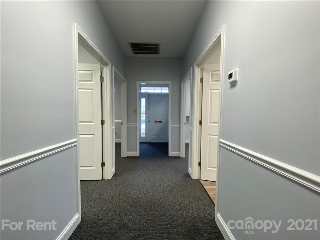 1552 Union Road, Unit B Gastonia, NC 28054 - Photo 10 of 12 a view of a hallway with wooden shelves
