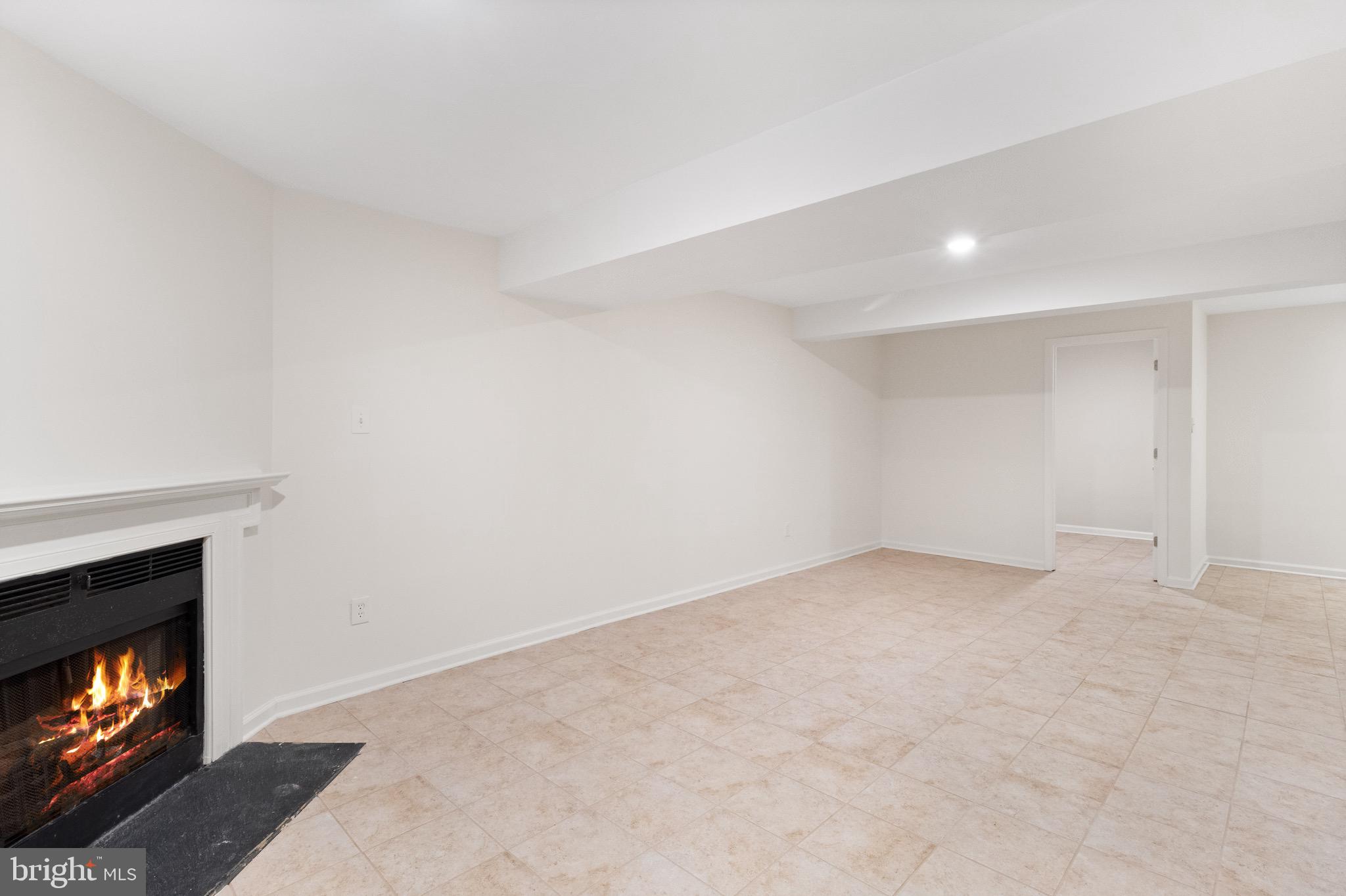 8581 Chester Grove Court Springfield, VA 22153 - Photo 34 of 38 a view of an empty room with a fireplace