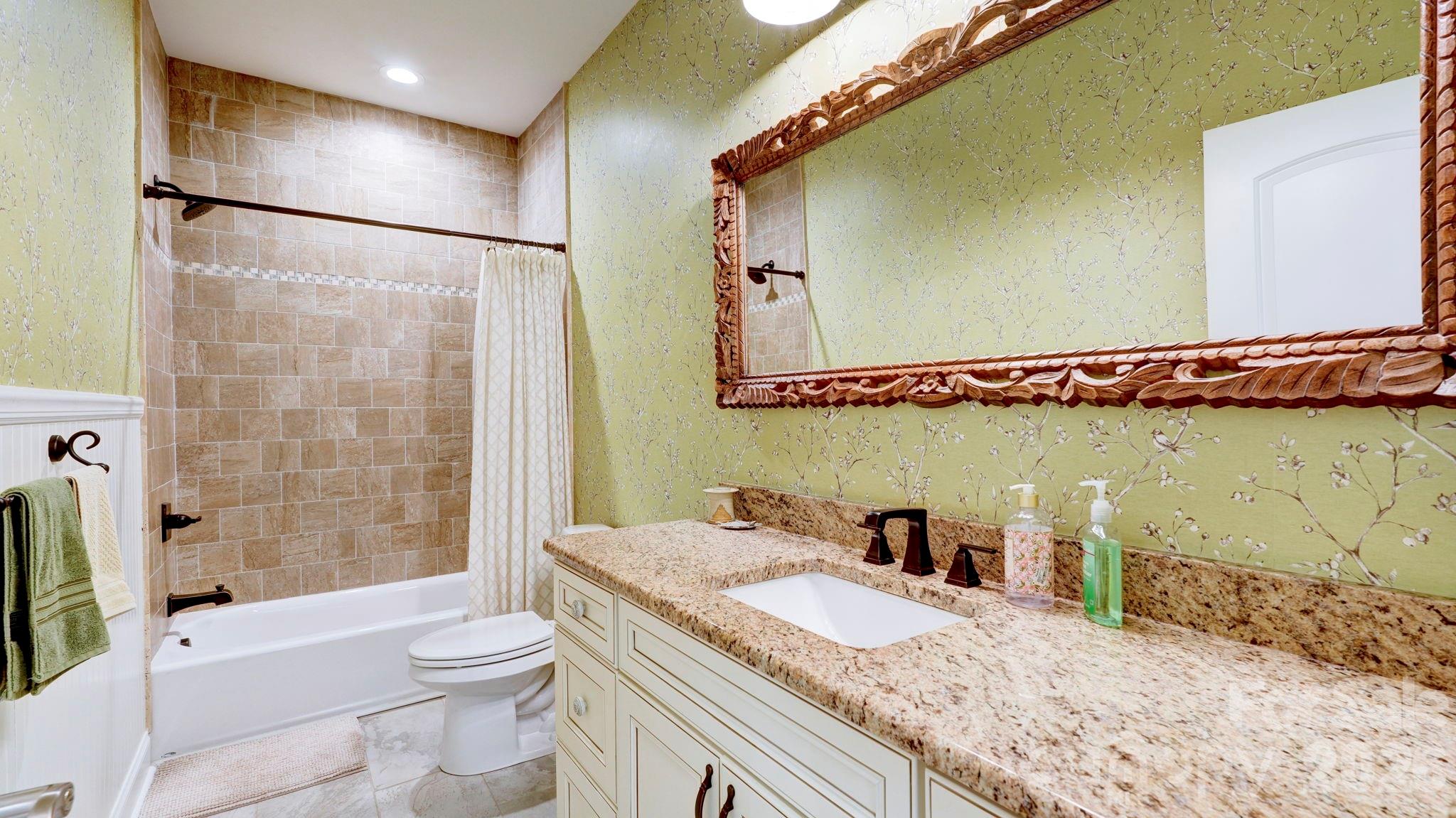 1775 Enochville Road Kannapolis, NC 28081 - Photo 38 of 41 a bathroom with a granite countertop sink a toilet a mirror and shower