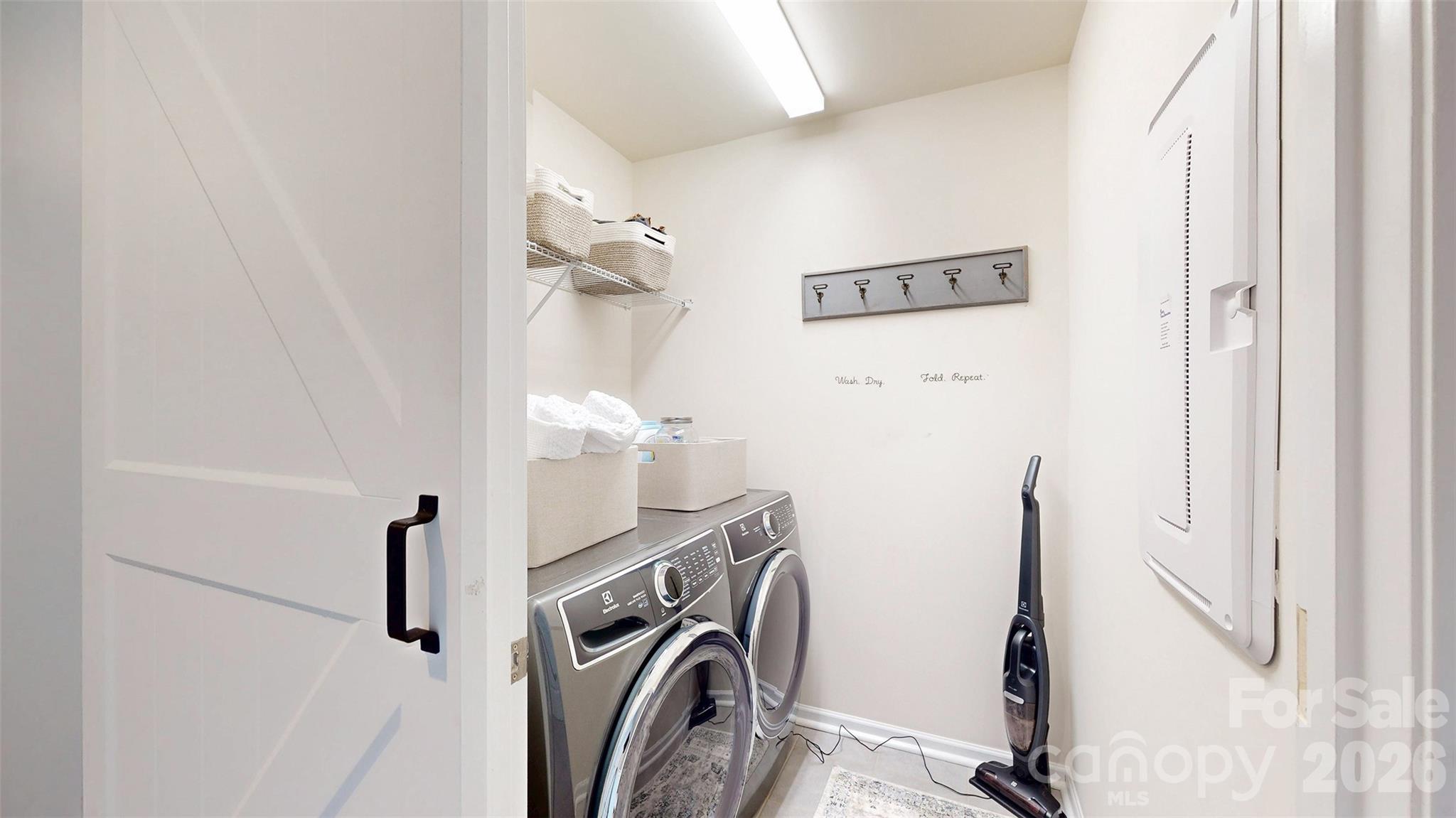 827 Canoe Song Road Fort Mill, SC 29708 - Photo 22 of 33 a view of a storage and utility room with racks on the wall