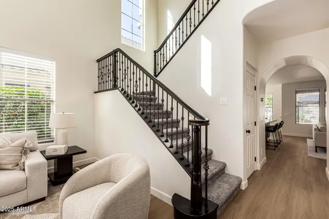 a view of a dining room with furniture and a window