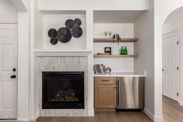 a kitchen with a center island appliances and cabinets