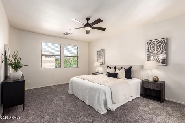 a bathroom with a double vanity sink mirror and shower