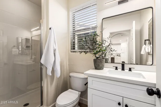an empty room with a ceiling fan and window