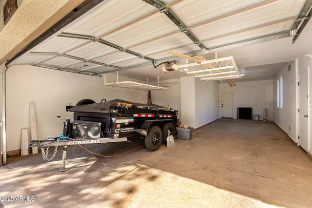 a view of a house with backyard and a tree