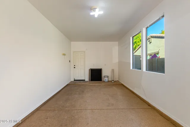 a view of a house with backyard and tree
