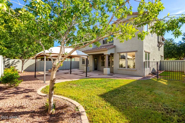 a backyard of a house with seating space