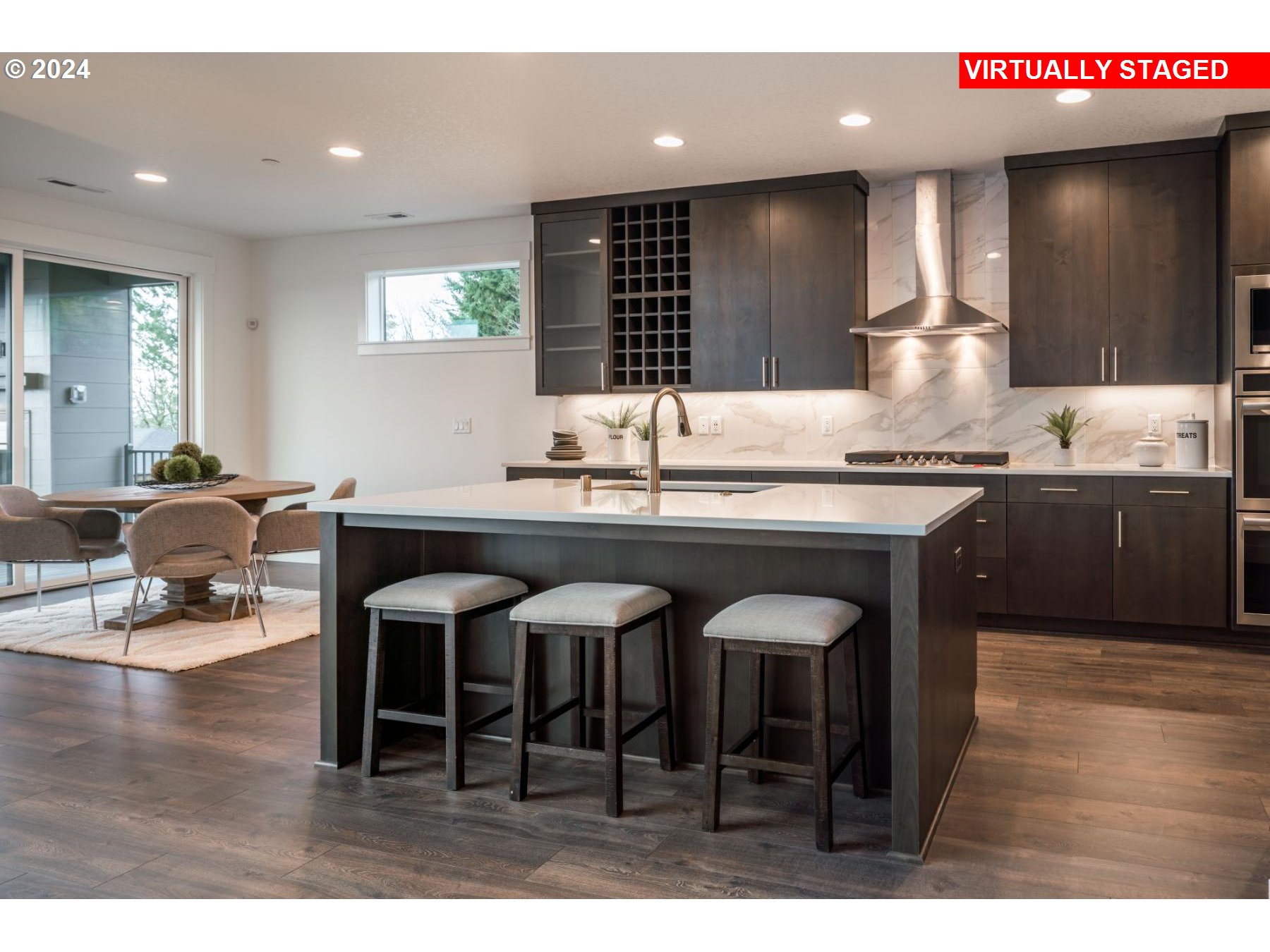 1119 South Mountain Place Ridgefield, WA 98642 - Photo 6 of 17 a kitchen with a sink and chairs