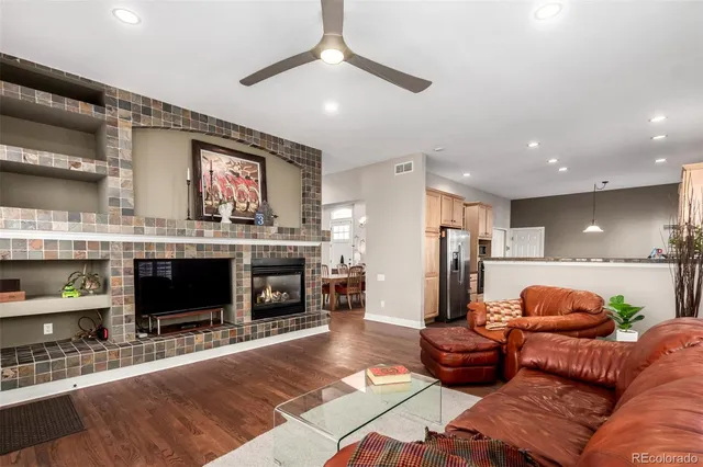 a living room with furniture and a fireplace