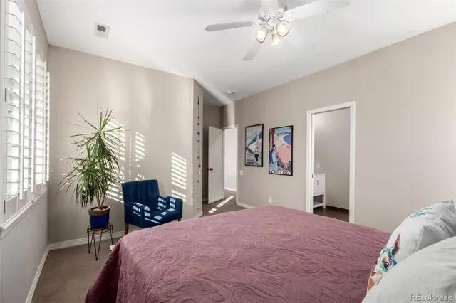 a bedroom with a bed dresser and a window