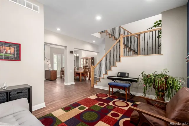 a living room with furniture and a rug