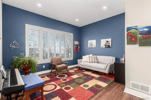 a living room with furniture and a rug