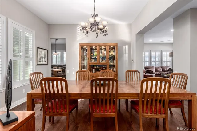 a kitchen with kitchen island granite countertop a stove and a sink