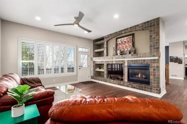 a bedroom with furniture and a fireplace