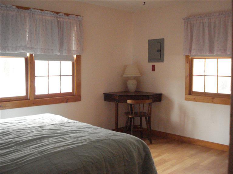 94 Harbor Hills Road Centerville, MA 02632 - Photo 4 of 10 a bedroom with a bed and a window