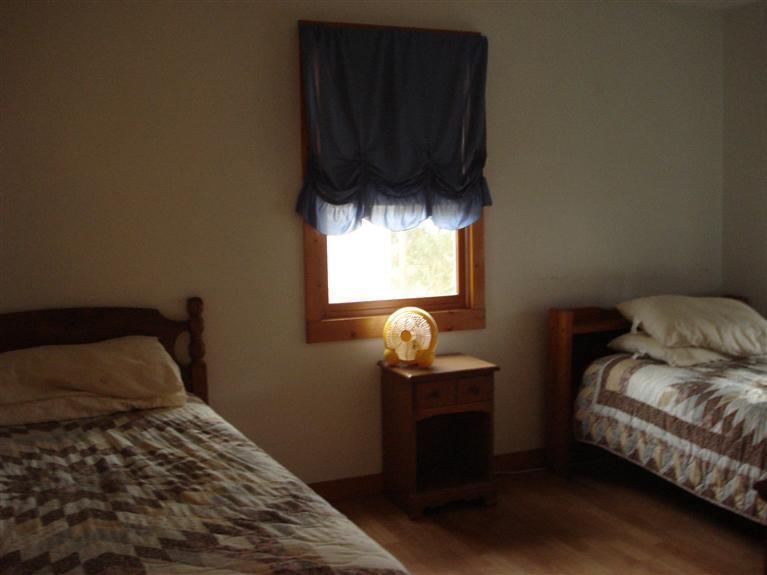 94 Harbor Hills Road Centerville, MA 02632 - Photo 6 of 10 a bedroom with a bed and a window